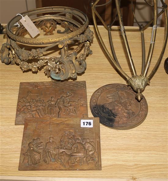 Two gilt metal vase stands, three cast plaques and a lantern frame